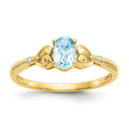 10k 6x4mm Oval December/ Light Swiss Blue Topaz and Diamond Ring