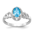 10k White Gold 7x5mm Oval December/ Light Swiss Blue Topaz and Diamond Ring
