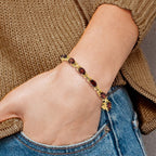 14k Complete 7x5mm Oval Garnet X-design 7 inch Bracelet
