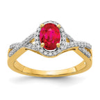 14k 7x5mm Oval Ruby and 1/5 carat Diamond Halo Ring