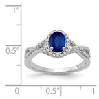 14k White Gold 7x5mm Oval Blue Sapphire and 1/5 carat Diamond Halo Ring