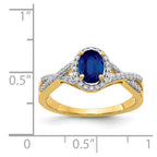 14k 7x5mm Oval Blue Sapphire and 1/5 carat Diamond Halo Ring