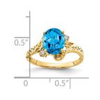 14k 9x7mm Oval Blue Topaz and A Diamond Ring