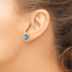 14k 8x6mm Oval Checker-cut Blue Topaz Post Earrings
