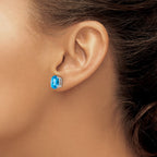 14k White Gold 9x7mm Oval Checker-cut Blue Topaz Post Earrings