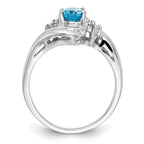 14k White Gold 7x5mm Oval Blue Topaz and 1/15 carat A Diamond Ring
