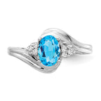 14k White Gold 7x5mm Oval Blue Topaz and 1/15 carat VS Diamond Ring