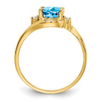14k 8x6mm Oval Blue Topaz and 1/20 carat VS Diamond Ring