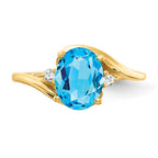 14k 8x6mm Oval Blue Topaz and 1/20 carat VS Diamond Ring