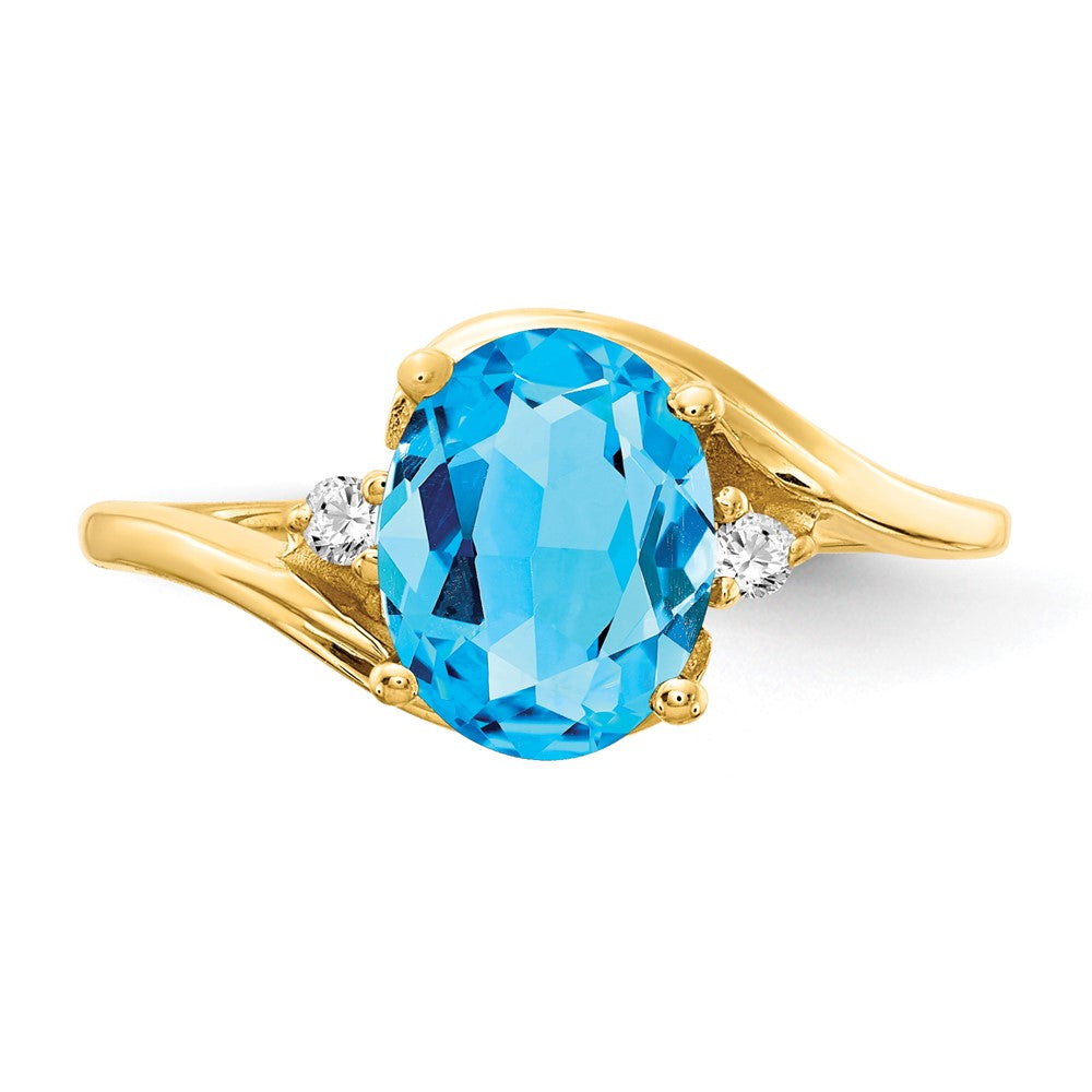 14k 8x6mm Oval Blue Topaz and 1/20 carat VS Diamond Ring