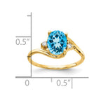14k 8x6mm Oval Blue Topaz and 1/20 carat A Diamond Ring