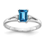 14k White Gold 6x4mm Emerald-cut Blue Topaz and VS Diamond Ring